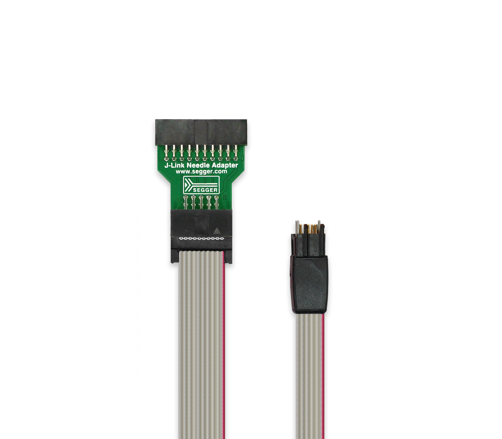 A J-Link Needle Adapter is displayed, featuring a green circuit board with multiple pin connections on one end and a smaller connector with four pins on the other end. The adapter is connected by a flat ribbon cable, indicating a compact and specialized device for programming or debugging electronic circuits.